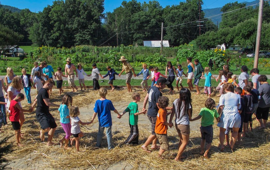 Children playing in circle at Camp Celo Farm